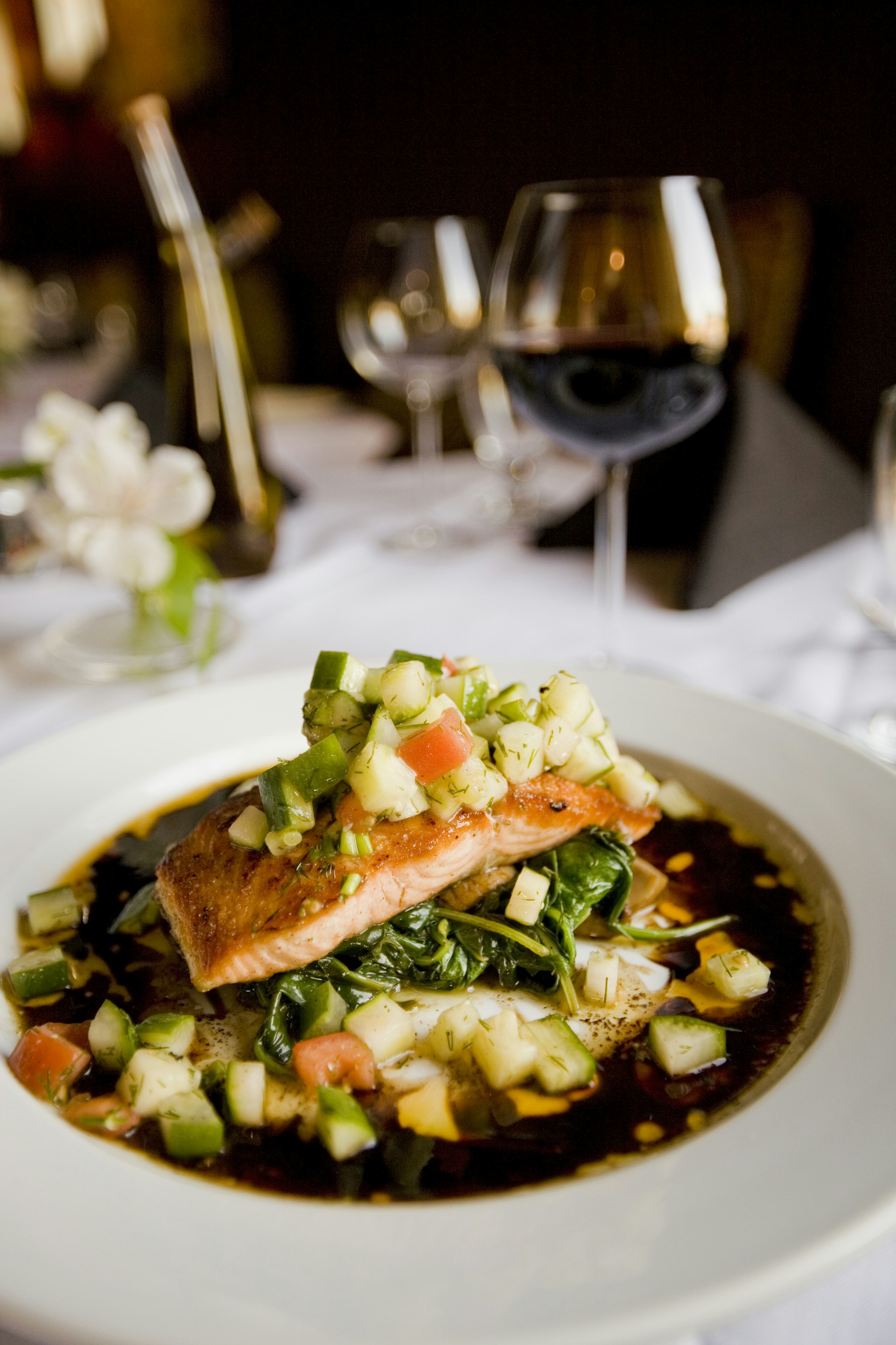 top down view of an elegant gourmet dish on a dark rustic table, dramatic lighting, sharp focus, fine dining food photography